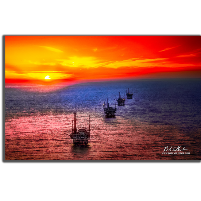 Offshore drilling as the sun sets behind a row of rigs. The Beauty of Offshore By Bob Callender