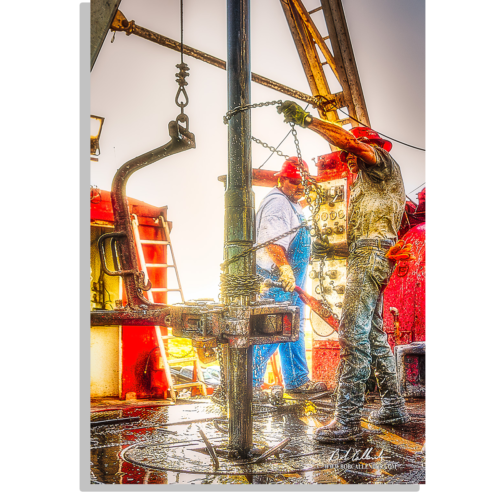 Throwing the Chain on the rig floor, a crew is hard at work. Photo by Bob Callender