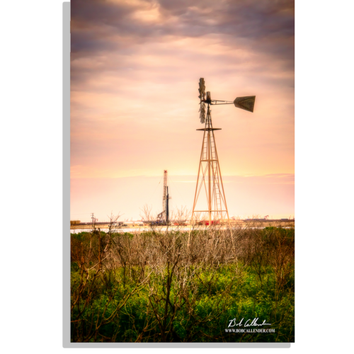 An photo of a windmill and pulling unit with the West Texas landscape. Winds at Liberty by Bob Callender