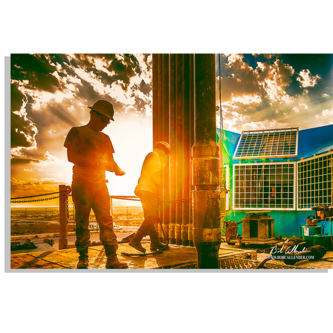 As the sunsets oilfield rig crew is busy at work. Workin the Dream by Bob Callender