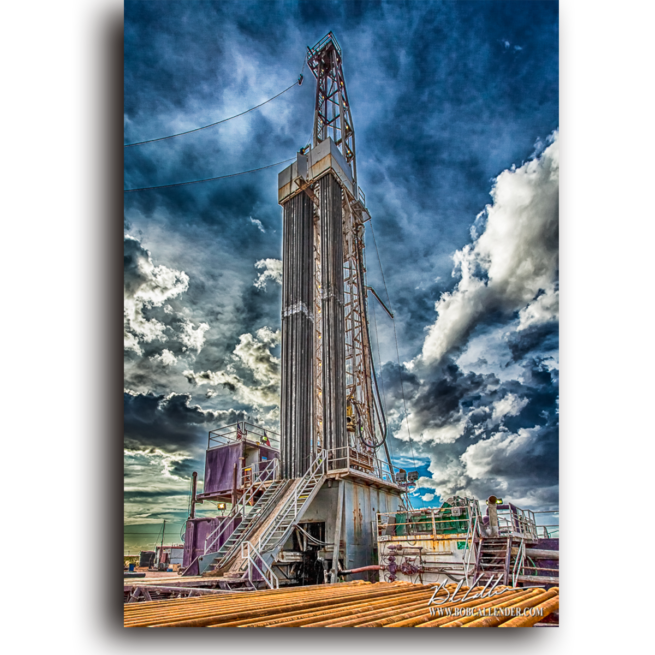 An oil rig and blue sky full of white clouds set the tone for Dreamin by Bob Callender