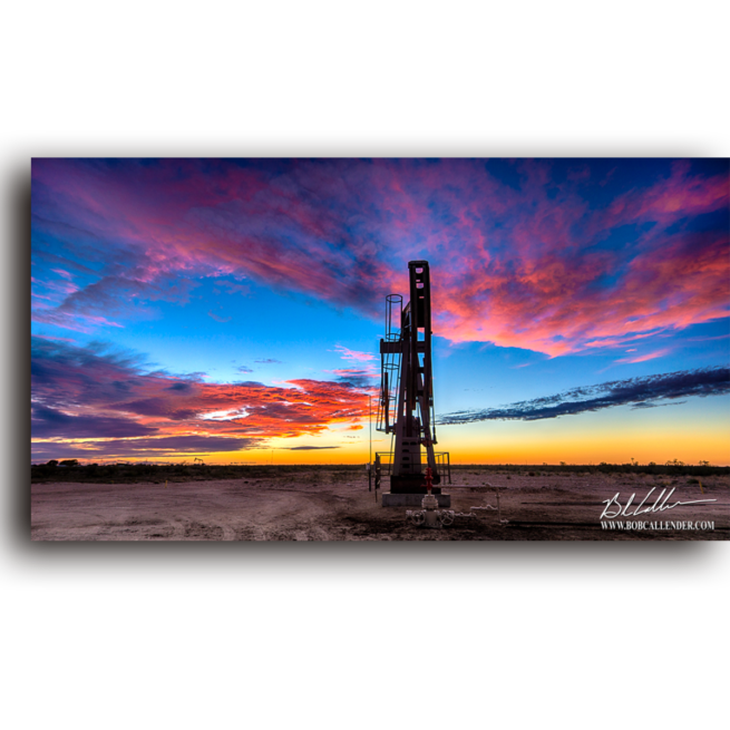 A still pump jack as the sunset glows and the day ends. Evening Silence by Bob Callenderr