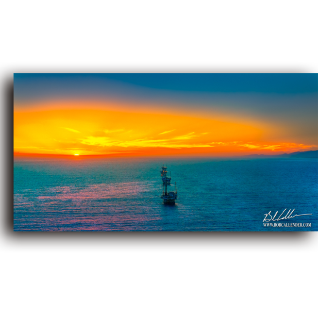 A rig just offshore caught perfectly at the end of the day. Offshore Sunset by Bob Callender