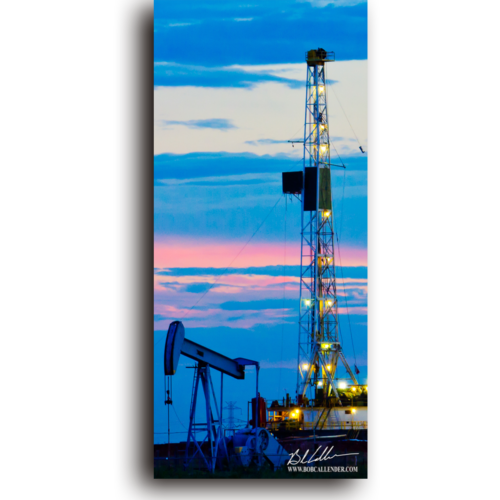 A pastel sky around a rig and pump jack. Painted Sky II by Bob Callender