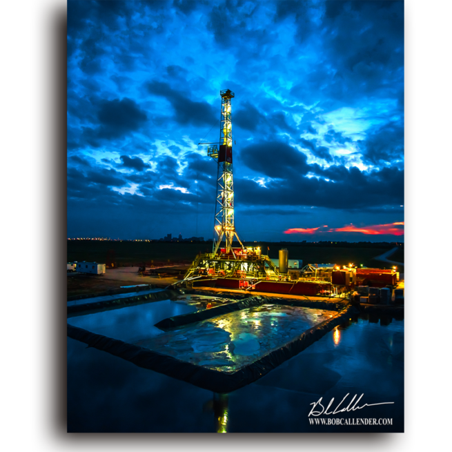 Rig reflections at sunset in front of a blue night sky. Reflections by Bob Callender