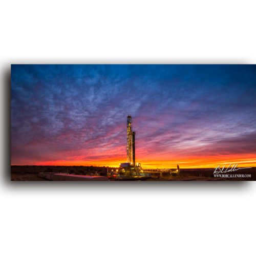 A rig standing alone at sunset in the perfect Solitude by Bob Callender