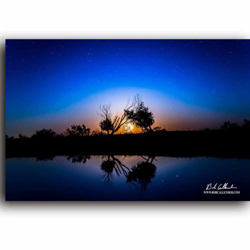 Sunset on a with blues and orange in Sweet Texas Night by Bob Callender.