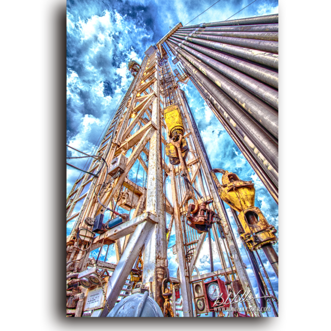 A member of the rig crew makes a dangerous climb To the Top. Photo by Bob Callender